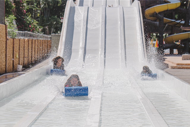 kids sliding in a water park in Hawaii